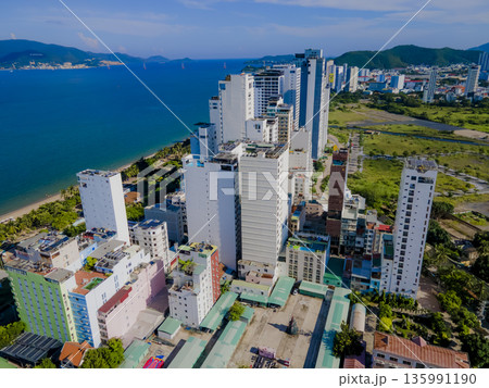 Flying over a coastal city. Flying over a coastal city. 135991190