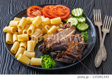 roasted pork ribs with pasta and fresh vegetables roasted pork ribs with pasta and fresh vegetables 135991345