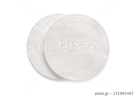 A cotton pad for cosmetic procedures. Isolated on a white background A cotton pad for cosmetic procedures. Isolated on a white background 135992487