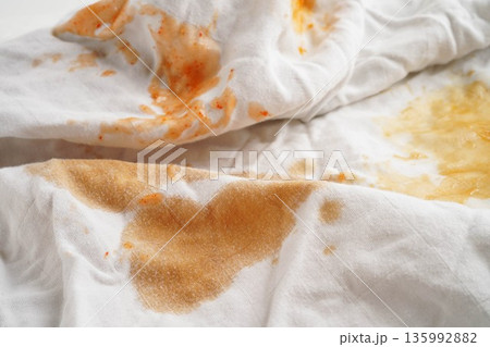 Dirty tomato sauce stain removal or ketchup on cloth accident to wash with washing powder, cleaning housework. Dirty tomato sauce stain removal or ketchup on cloth accident to wash with washing powder, cleaning housework. 135992882