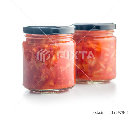 Fermented cabbage. Kimchi. Korean food in jar isolated on white background. Fermented cabbage. Kimchi. Korean food in jar isolated on white background. 135992906