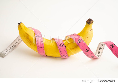 Banana with measuring tape, penis health. 135992984