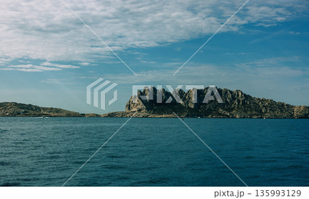 Rocky island with jagged peaks 135993129