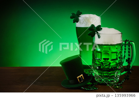 St. Patrick's day celebration with green beer and shamrock decor St. Patrick's day celebration with green beer and shamrock decor 135993966