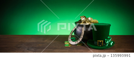 St. Patrick's day pot of gold with leprechaun hat and horseshoe St. Patrick's day pot of gold with leprechaun hat and horseshoe 135993991