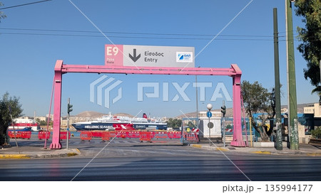 Pink entrance gate to the ferry terminal in Greece 135994177