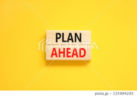 Plan ahead symbol. Concept word Plan ahead on beautiful wooden blocks. Beautiful yellow paper background. Business plan ahead concept. Copy space. Plan ahead symbol. Concept word Plan ahead on beautiful wooden blocks. Beautiful yellow paper background. Business plan ahead concept. Copy space. 135994285