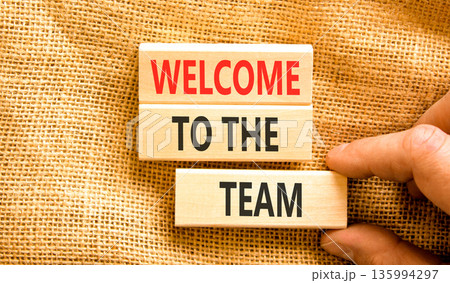 Support, help welcome to the team symbol. Concept words Welcome to the team on beautiful wooden blocks. Beautiful canvas background. Businessman's hand. Business welcome to team concept. Copy space. Support, help welcome to the team symbol. Concept words Welcome to the team on beautiful wooden blocks. Beautiful canvas background. Businessman's hand. Business welcome to team concept. Copy space. 135994297