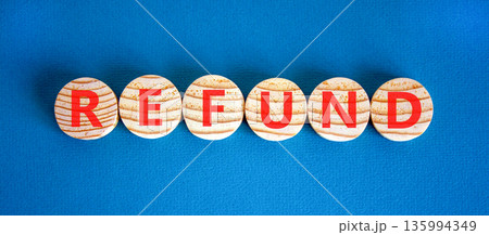Refund word symbol. Concept word Refund on beautiful wooden circles. Beautiful blue background. Business word refund concept. Copy space. Refund word symbol. Concept word Refund on beautiful wooden circles. Beautiful blue background. Business word refund concept. Copy space. 135994349