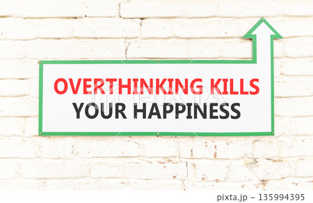 Overthinking kills your happiness symbol. Concept words Overthinking kills your happiness on sign plate. Beautiful brick wall background. Business overthinking kills happiness concept. Copy space. Overthinking kills your happiness symbol. Concept words Overthinking kills your happiness on sign plate. Beautiful brick wall background. Business overthinking kills happiness concept. Copy space. 135994395