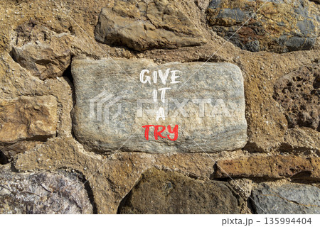 Give it a try symbol. Concept word Give it a try on beautiful stone. Beautiful stone wall background. Business give it a try concept. Copy space. Give it a try symbol. Concept word Give it a try on beautiful stone. Beautiful stone wall background. Business give it a try concept. Copy space. 135994404