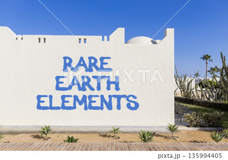 Rare earth elements symbol. Concept words Rare earth elements on beautiful white wall. Beautiful white wall blue sky background. Business and rare earth elements concept. Copy space. 135994405