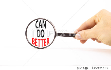Can do better symbol. Concept words Can do better on beautiful white paper in magnifying glass. Beautiful white paper background. Businessman hand. Business and can do better concept. Copy space. 135994425