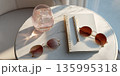Minimalist cafe table for one with a drink and chic accessories 135995318
