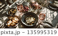 A vibrant lunch scene features a table adorned with various dishes and drinks 135995319