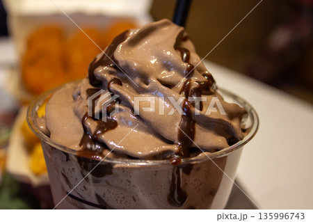 Chocolate ice cream dessert in fast food restaurant 135996743