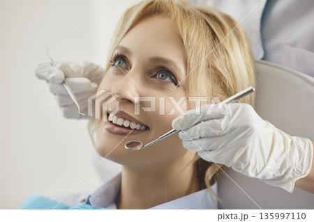 Female patient in modern dentistry clinic during medical check up in medical center. Female patient in modern dentistry clinic during medical check up in medical center. 135997110