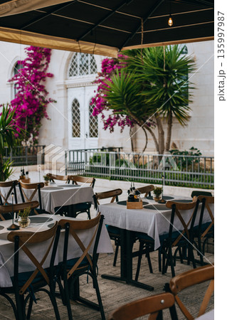 Empty cafe on a street in Trogir old town, Croatia. Travel destination in Croatia. Empty cafe on a street in Trogir old town, Croatia. Travel destination in Croatia. 135997987