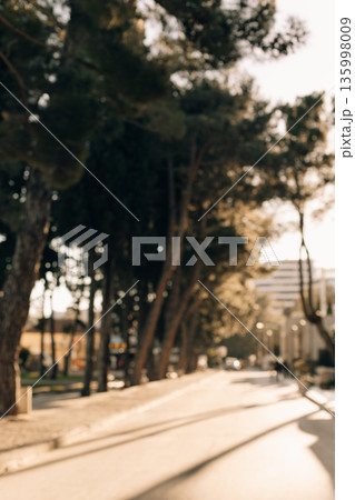 Defocused view of a sunny street in Budva, Montenegro. 135998009