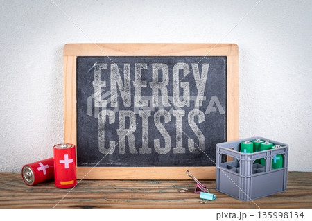 Energy Crisis Concept With Batteries And Chalkboard Message Energy Crisis Concept With Batteries And Chalkboard Message 135998134