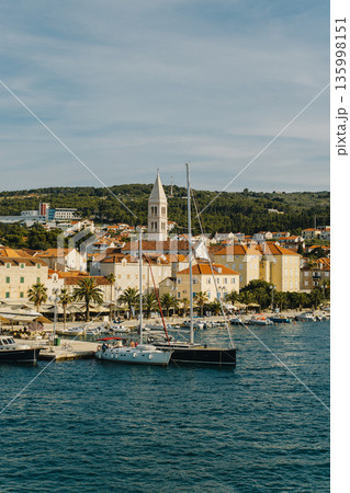 Amazing view of yacht marina and old town Supetar, Brac island, Croatia. Beautiful sunny day. 135998151