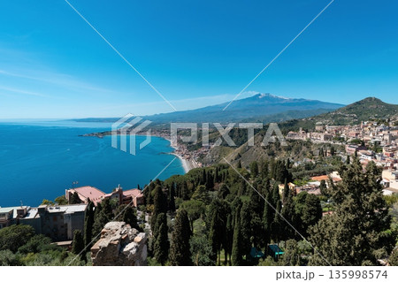 Taormina coast panorama with Mount Etna volcano in Sicily, Italy 135998574