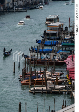 Venice canal traffic with gondolas and water bus, view from above. Venice, Italy 135998576