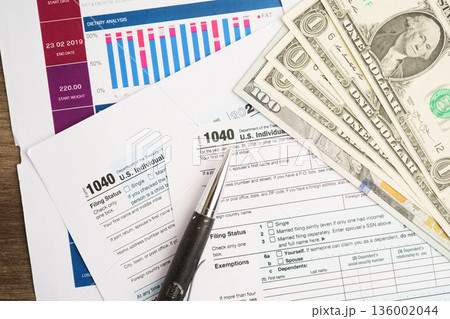 Tax form 1040 U.S. Individual Income Tax Return, business finance concept. 136002044