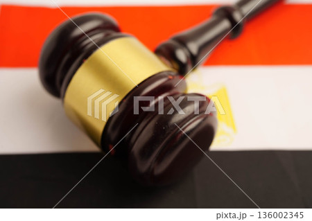 Egypt, justice and agreement, wooden court gavel on flag. Egypt, justice and agreement, wooden court gavel on flag. 136002345