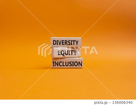 Diversity Equity Inclusion symbol. Concept words Diversity Equity Inclusion on wooden blocks. Beautiful orange background. Business and Diversity Equity Inclusion concept. Copy space Diversity Equity Inclusion symbol. Concept words Diversity Equity Inclusion on wooden blocks. Beautiful orange background. Business and Diversity Equity Inclusion concept. Copy space 136006340