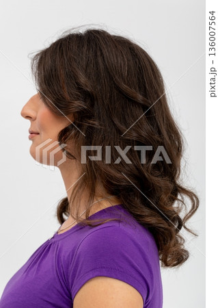 Business woman portrait, Elegant female headshot with curls, Professional woman image with textured blouse, Corporate profile picture featuring woman with soft lighting and curls 136007564