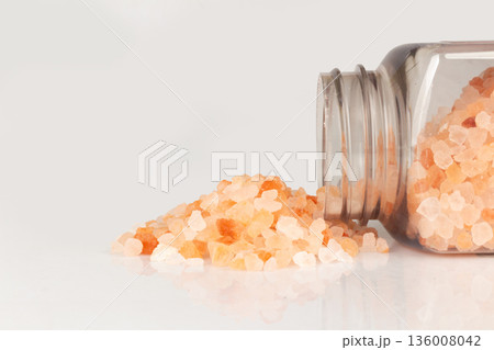 pink salt bottle isolated on white background pile 136008042