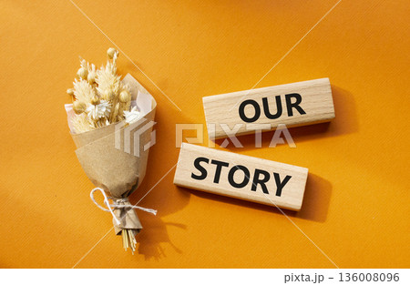 Our story symbol. Wooden blocks with words Our story. Beautiful orange background. Business and Our story concept. Copy space. Our story symbol. Wooden blocks with words Our story. Beautiful orange background. Business and Our story concept. Copy space. 136008096