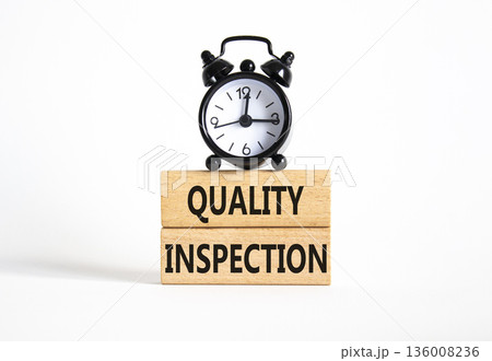 Quality Inspection symbol. Concept word Quality Inspection on wooden blocks. Beautiful white background with alarm clock. Business and Quality Inspection concept. Copy space Quality Inspection symbol. Concept word Quality Inspection on wooden blocks. Beautiful white background with alarm clock. Business and Quality Inspection concept. Copy space 136008236