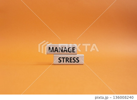 Manage stress symbol. Concept word Manage stress on wooden blocks. Beautiful orange background. Business and Manage stress concept. Copy space 136008240