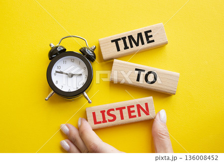 Time to listen symbol. Concept words Time to listen on wooden blocks. Businessman hand. Beautiful yellow background with alarm clock. Business and Time to listen concept. Copy space. 136008452