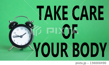 Health symbol. Wooden blocks with words Take Care of your Body. Beautiful green background with alarm clock. Health concept. Copy space. Health symbol. Wooden blocks with words Take Care of your Body. Beautiful green background with alarm clock. Health concept. Copy space. 136008490