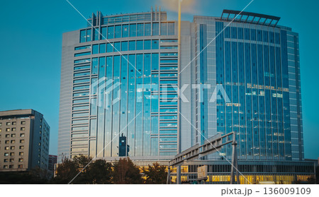 Beijing Dacheng Mansions. tall modern office tower illuminated against the twilight sky. Jinyu Building, Beijing Dacheng Mansions. tall modern office tower illuminated against the twilight sky. Jinyu Building, 136009109