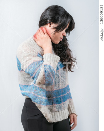 Asian woman with neck pain isolated. Suffering young woman with stress and neck pain Asian woman with neck pain isolated. Suffering young woman with stress and neck pain 136009185