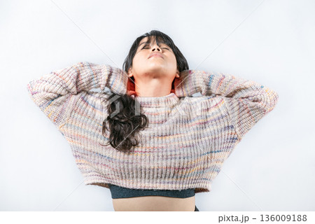 Asian girl suffering with stress and neck pain isolated. Female with neck pain on isolated background 136009188