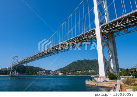 Kanmon Bridge by Kanmon Strait against blue sky, Kitakyushu Kanmon Bridge by Kanmon Strait against blue sky, Kitakyushu 136010058