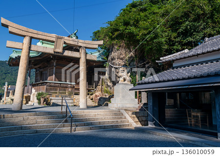 Torii gate to Mekari Shrine against blue sky, Kitakyushu 136010059