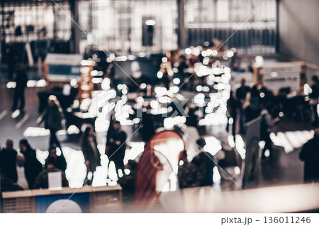 Abstract blurred people at exhibition hall of expo event trade show. Business convention show or job fair. Business concept background 136011246