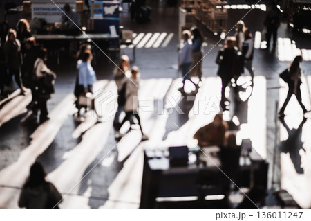 Abstract blurred people at exhibition hall of expo event trade show. Business convention show or job fair. Business concept background 136011247