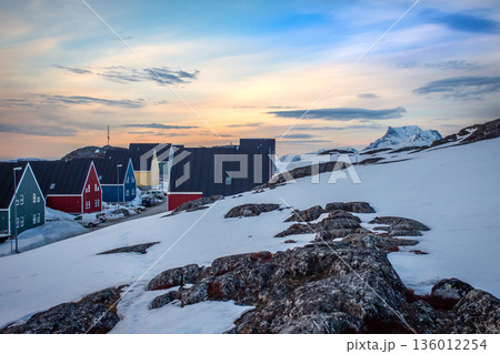 Arctic coastal settlement with colorful homes, snow, rocks and soft evening light, reflecting Greenlandic Inuit heritage and nordic architecture by the cold ocean fjord, Nuuk, Greenland Arctic coastal settlement with colorful homes, snow, rocks and soft evening light, reflecting Greenlandic Inuit heritage and nordic architecture by the cold ocean fjord, Nuuk, Greenland 136012254