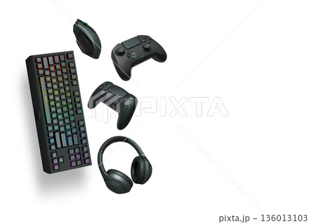 Gaming keyboard, mouse, controller and headphones floating in air, isolated on white background with clipping path. Gaming keyboard, mouse, controller and headphones floating in air, isolated on white background with clipping path. 136013103