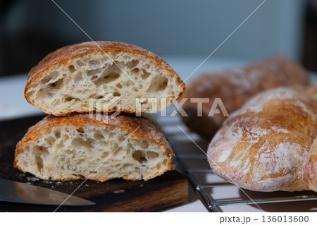 Rustic White Bread With a Golden Crust and Airy Crumb in a Home Kitchen 136013600