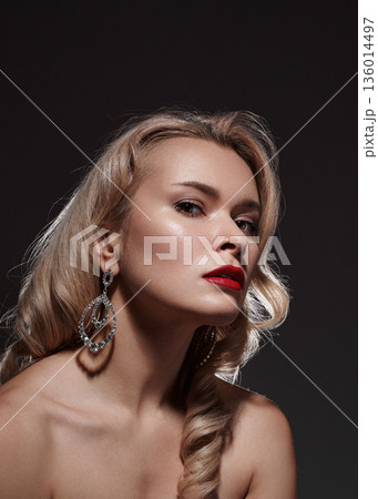 Moody Editorial Headshot Conveying Cool Confidence, Tilted Chin, Shadowed Cheek Sculpting, Smokey Eye Makeup, Long Vintage Wave, Reflective Earring Catch, Intimate Portrait Vibe, Subtle Cinematic 136014497