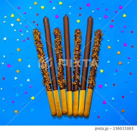 Dropped in chocolate a stick cookie Pepero. November 11th is Pepero Day in Korea 136015863