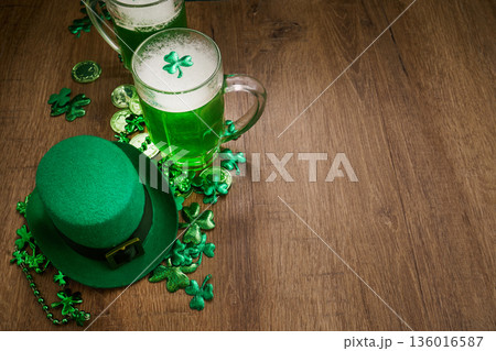 Celebrating st. Patrick's day with green beer and hat 136016587